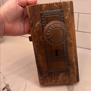 Antique door knob on antique wood